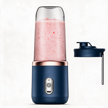 Navy portable blender with its travel lid and carrying strap beside it
